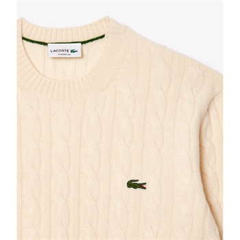 Pæn sand farvet strik med logo fra Lacoste